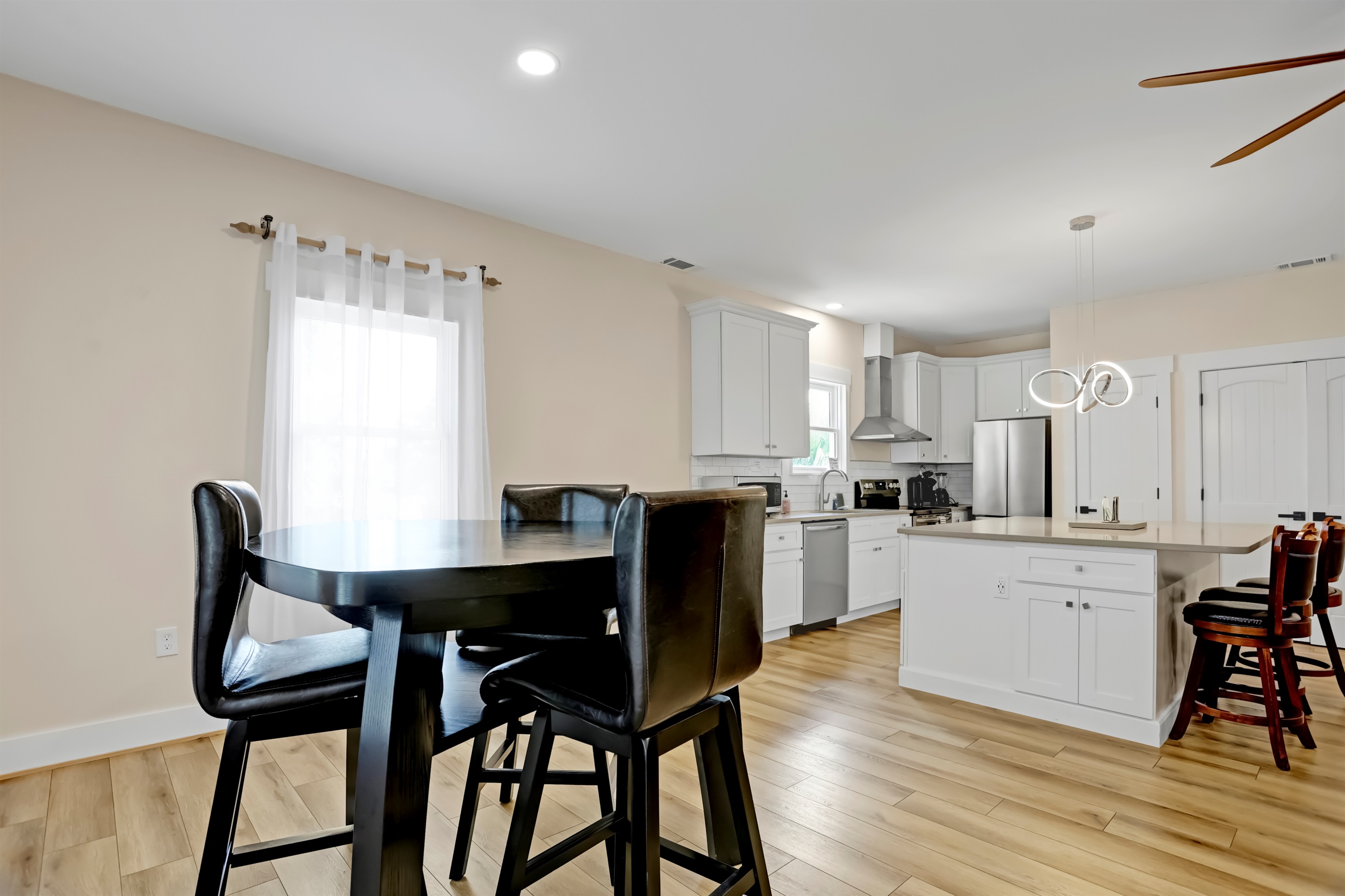 Share meals or morning coffee at the stylish high-top dining table.