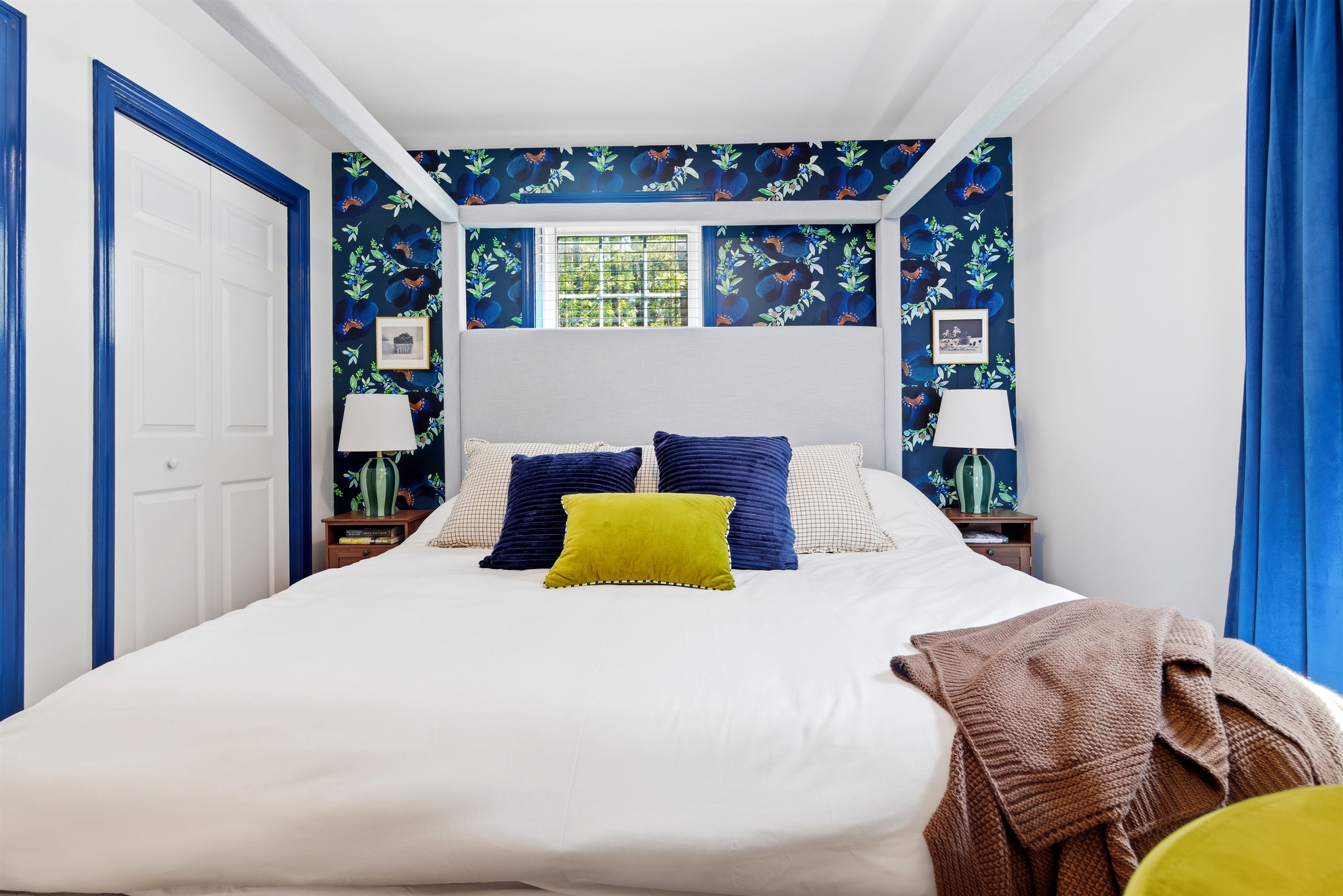 A comfortable and inviting king bed designed for restful sleep and quiet relaxation in a calming atmosphere.