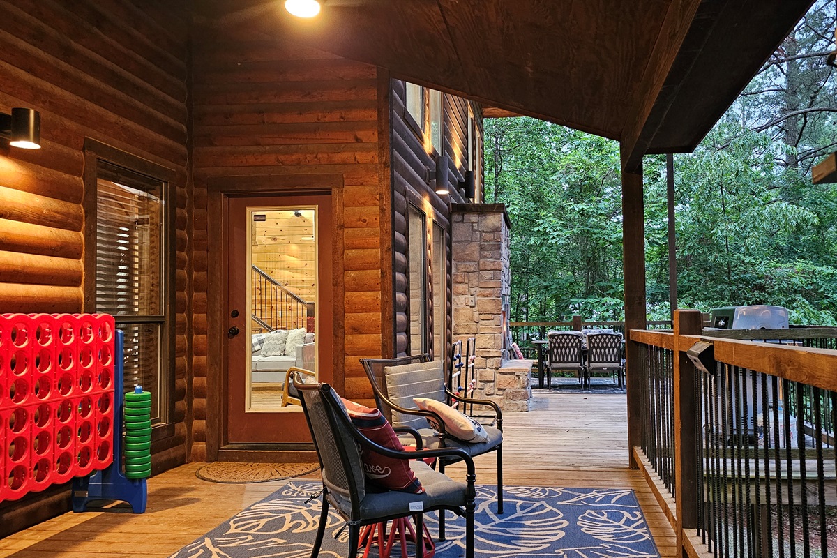 Outdoor Oasis: Have relaxing fun on the spacious back deck with games, grill, seating, gas log fireplace, and dining.