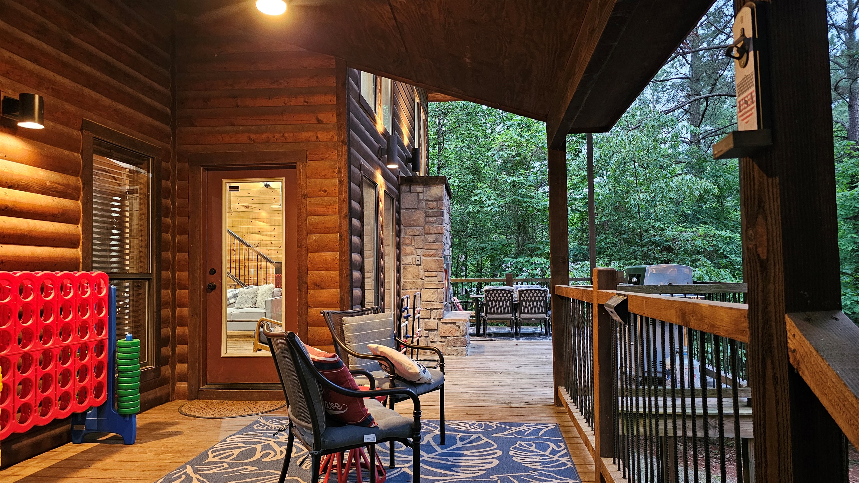 Outdoor Oasis: Have relaxing fun on the spacious back deck with games, grill, seating, gas log fireplace, and dining.