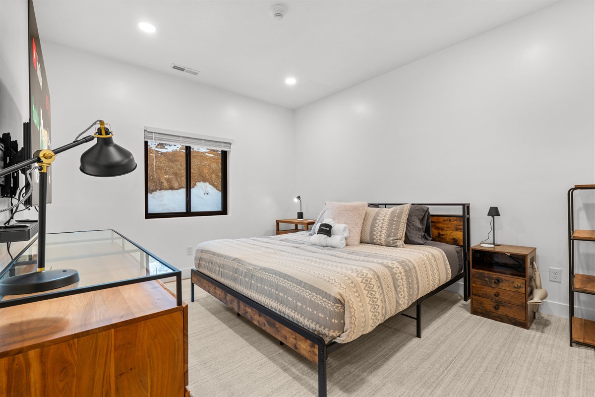 Recessed lighting, luxury linens, and comfortable bed.