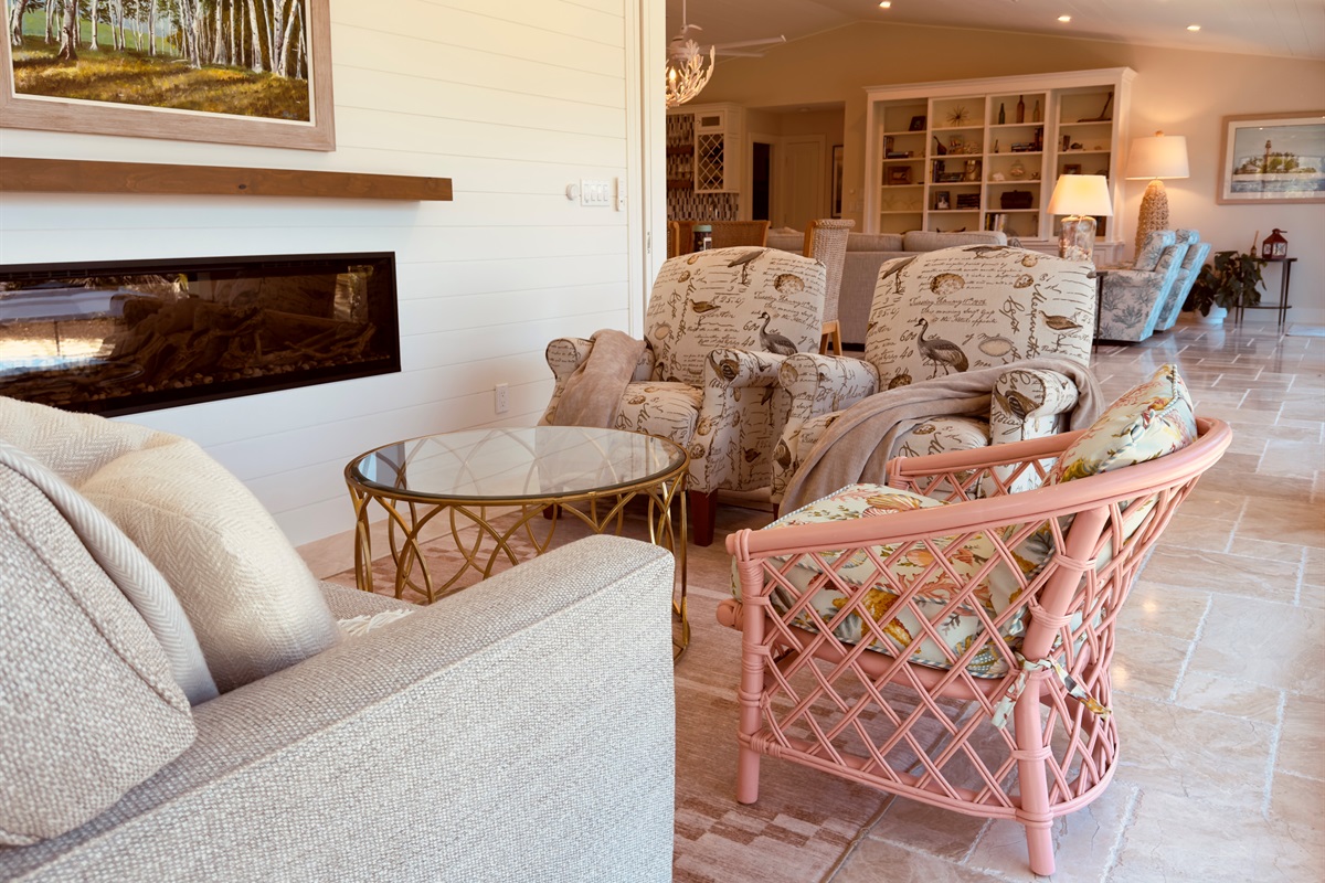 Cozy sitting area with electric fireplace.  Also features a retractable wall.