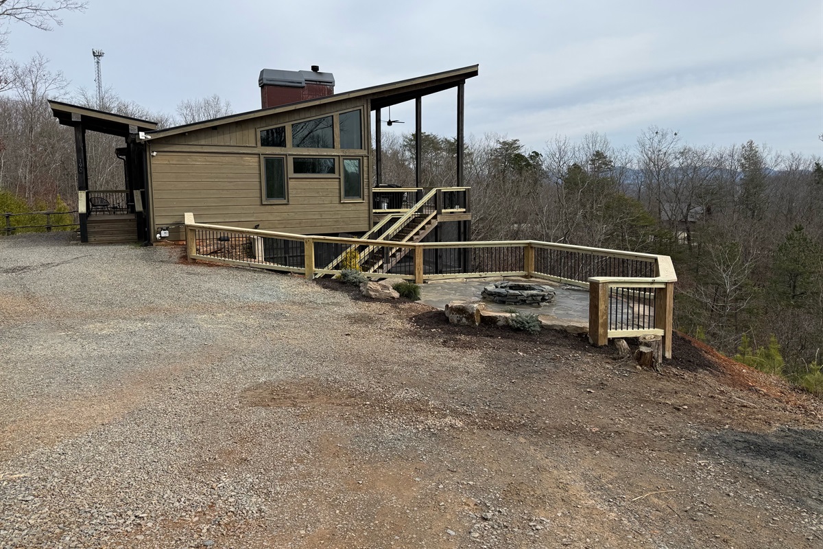 New Railing (being stained soon) and Firepit area. Seating coming soon.