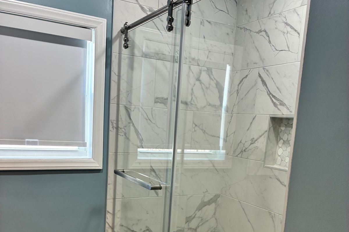 West - New tile bath shower with safety bar