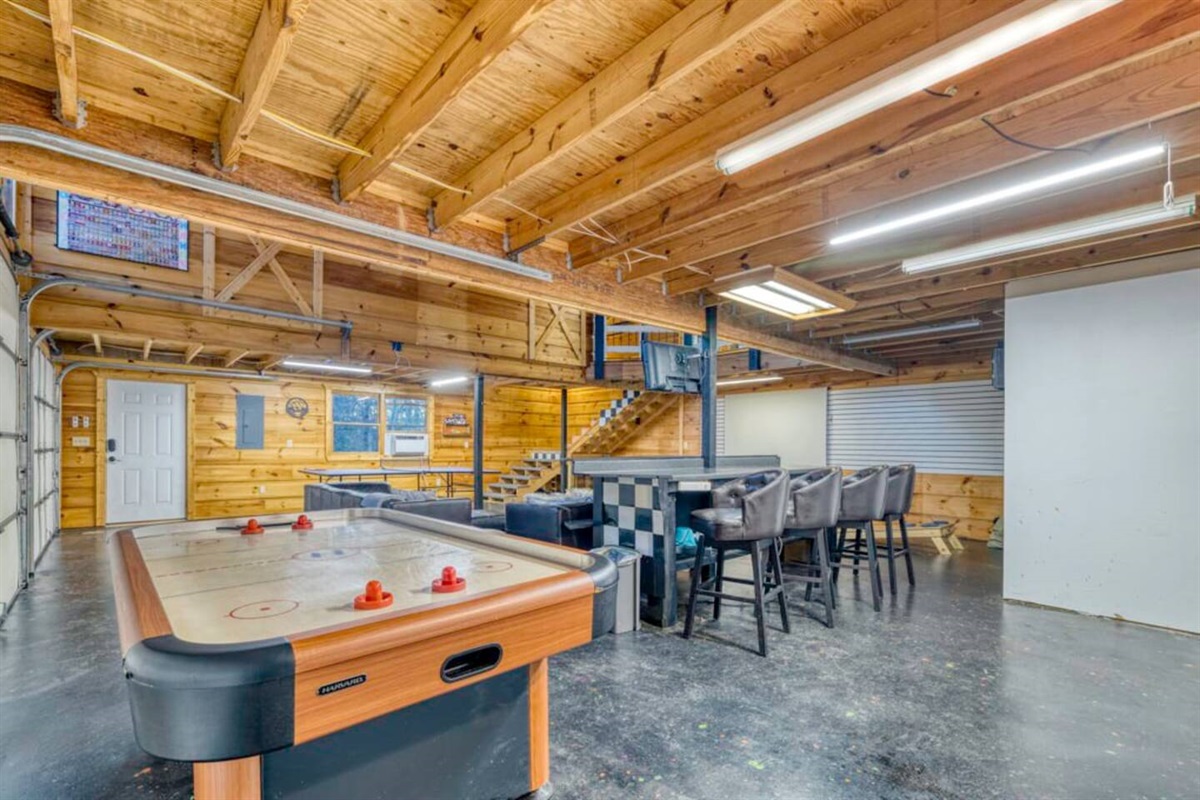 Dive into entertainment in the sprawling game room positioned right at the front of the house.