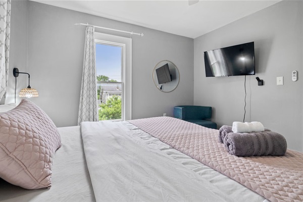 Bedroom 2 also has a King Bed, TV, and view of the backyard.  We know people appreciate having oversized bedding which is why we've added 2 king beds on the 2nd story floor.