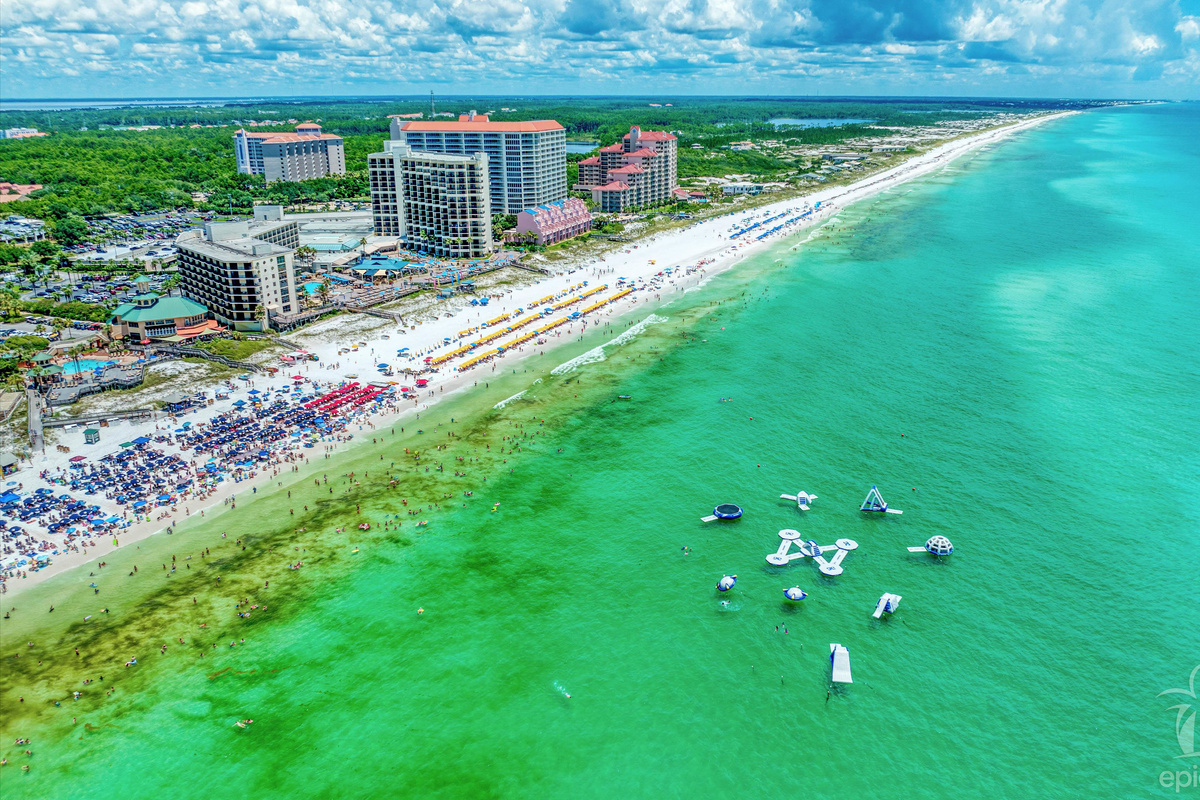 Aerial view of Beachside 1 and the emerald Gulf of Mexico