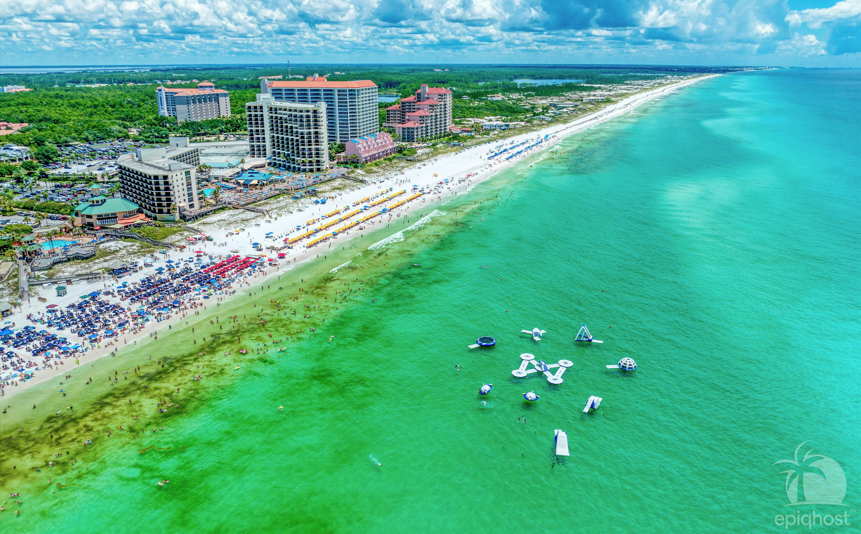 Aerial view of Beachside 1 and the emerald Gulf of Mexico
