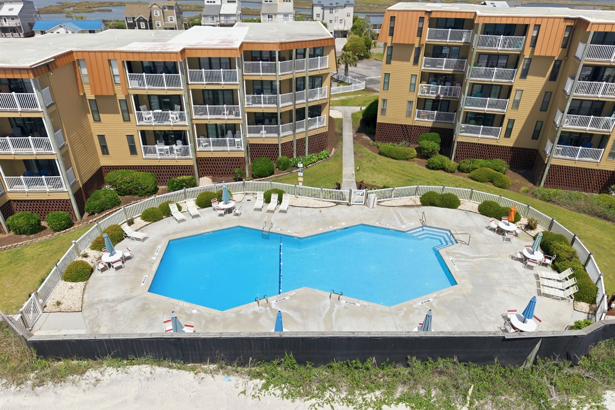Relax poolside while enjoying beautiful coastal surroundings