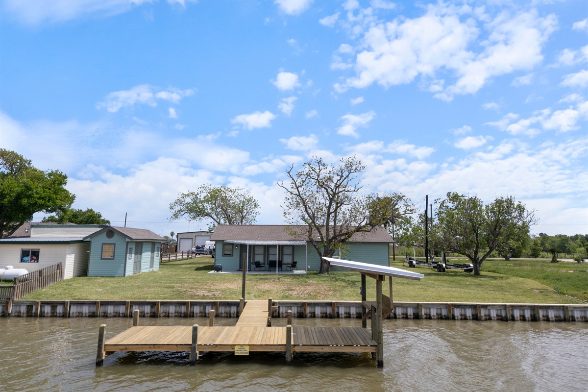 View of pier and backyard from the creek.
