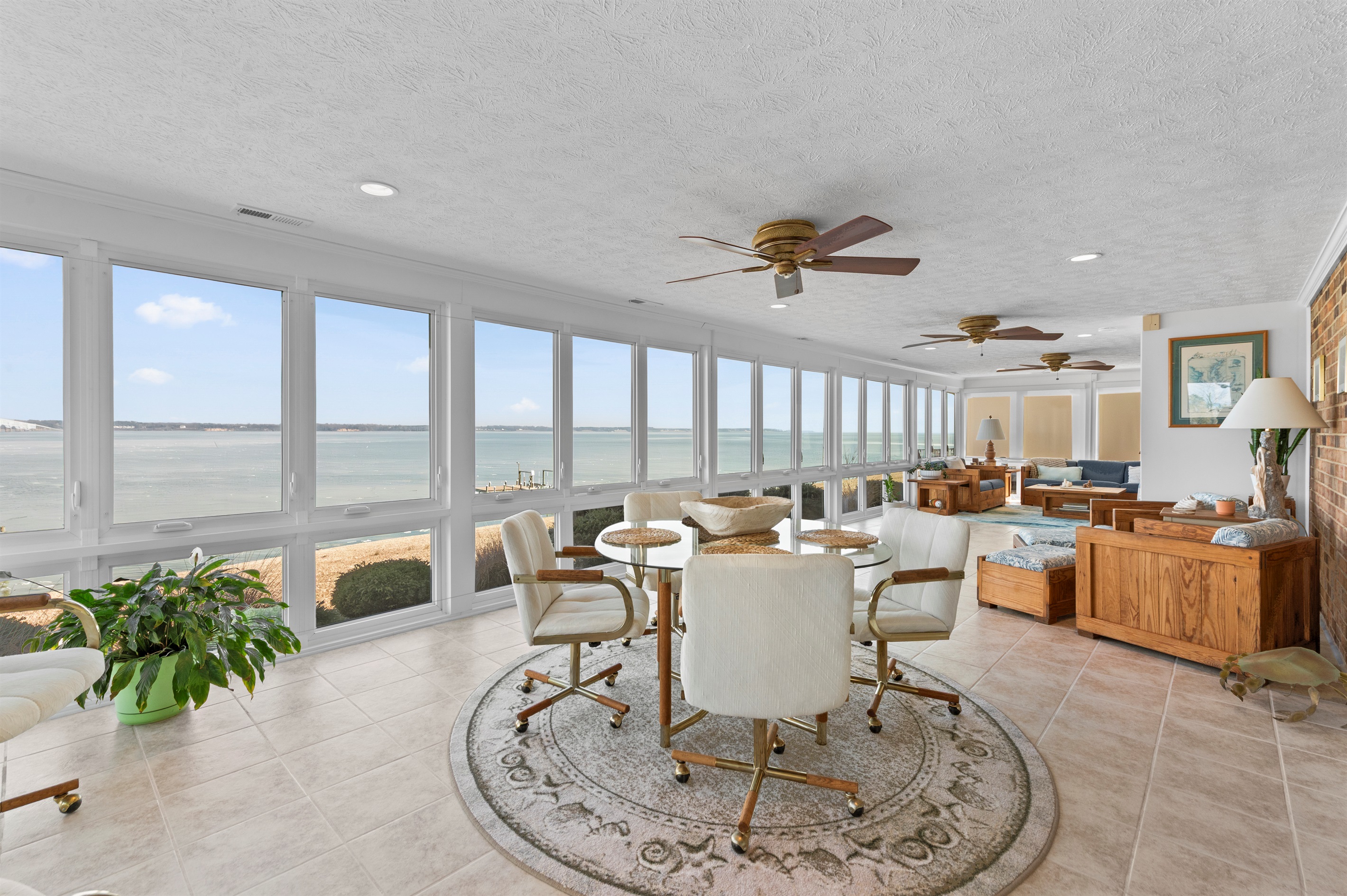 Sunroom Retreat: Brighten your days with stunning water views and elegant decor!