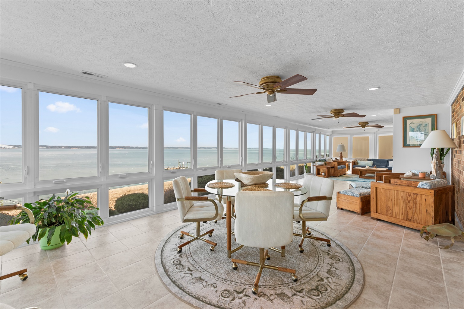 Sunroom Retreat: Brighten your days with stunning water views and elegant decor!