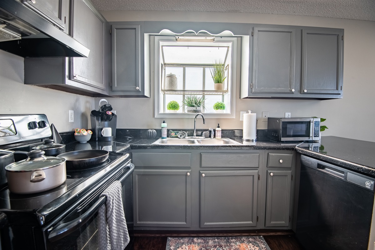 Unit B's full kitchen has plenty of natural lighting to enjoy slow mornings while sipping your coffee or whipping up a chef's breakfast.