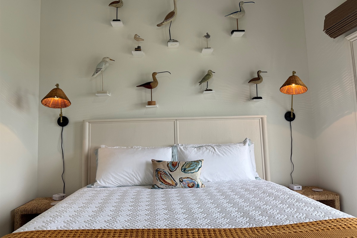 The Shorebird Room overlooks the Gulf, with deck access and remote control blinds.