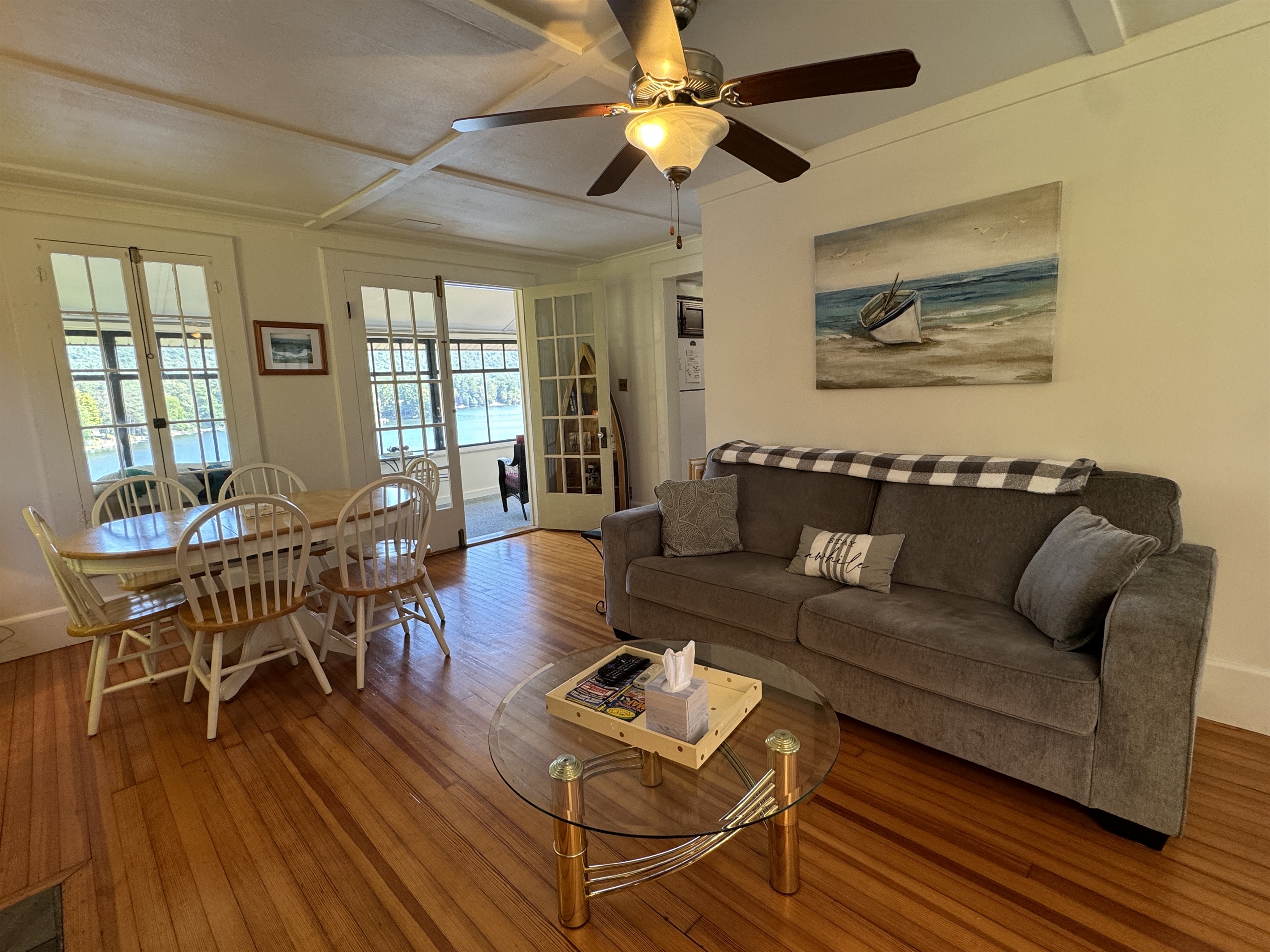 Living room/dining area with sunroom beyond