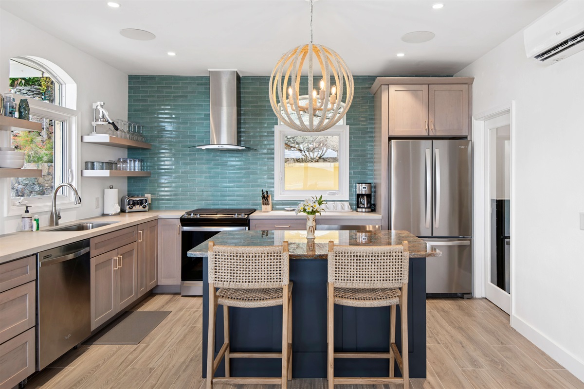 Fully stocked kitchen with stainless appliances, bar seating, coffee maker, blender, and all the tools to cook or sip in style. Enjoy free Wi-Fi throughout the villa.