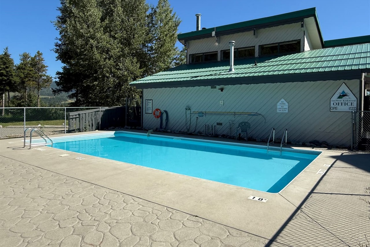 Cool down in the shared outdoor pool (open seasonally) which overlooks the stunning mountain landscape surrounding the townhouse complex