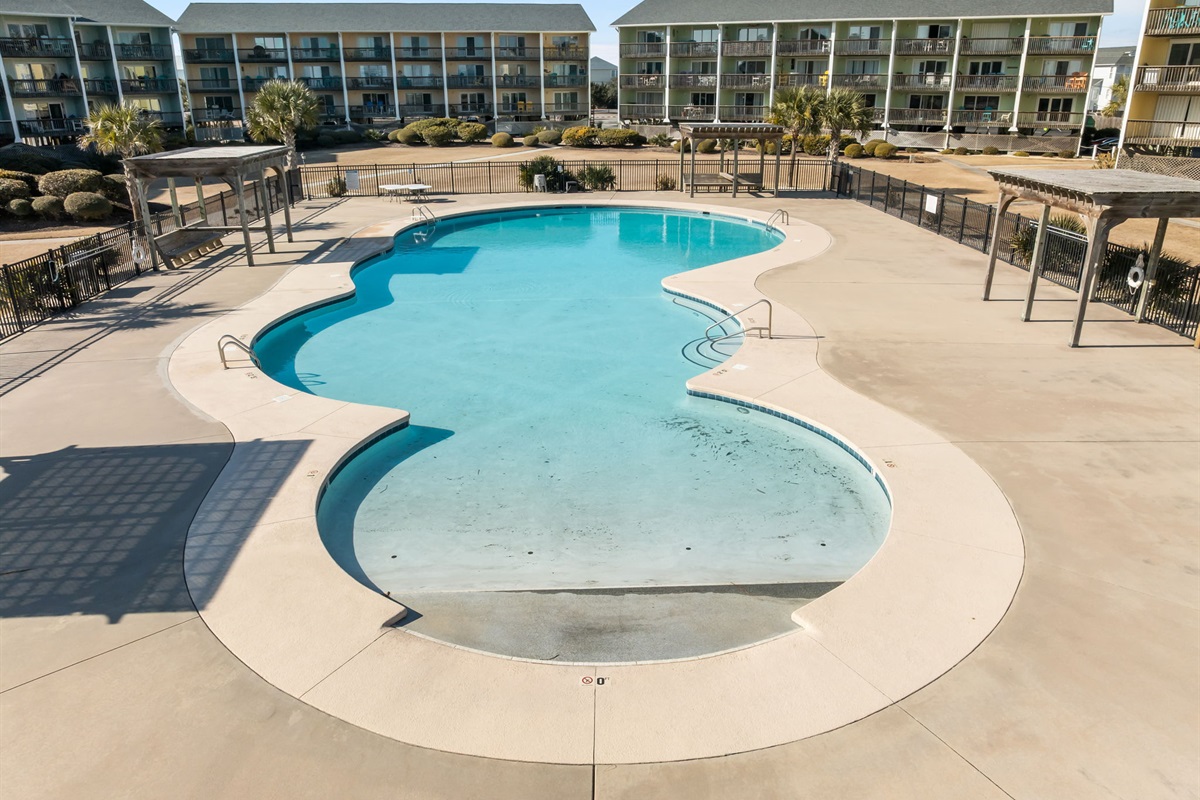 Seasonal community pool at Surf Condos, perfect for cooling off on warm beach days