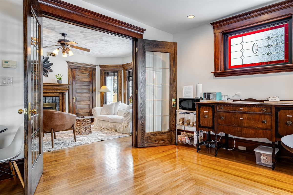 Shared breakfast area with toaster, microwave, and fridge.