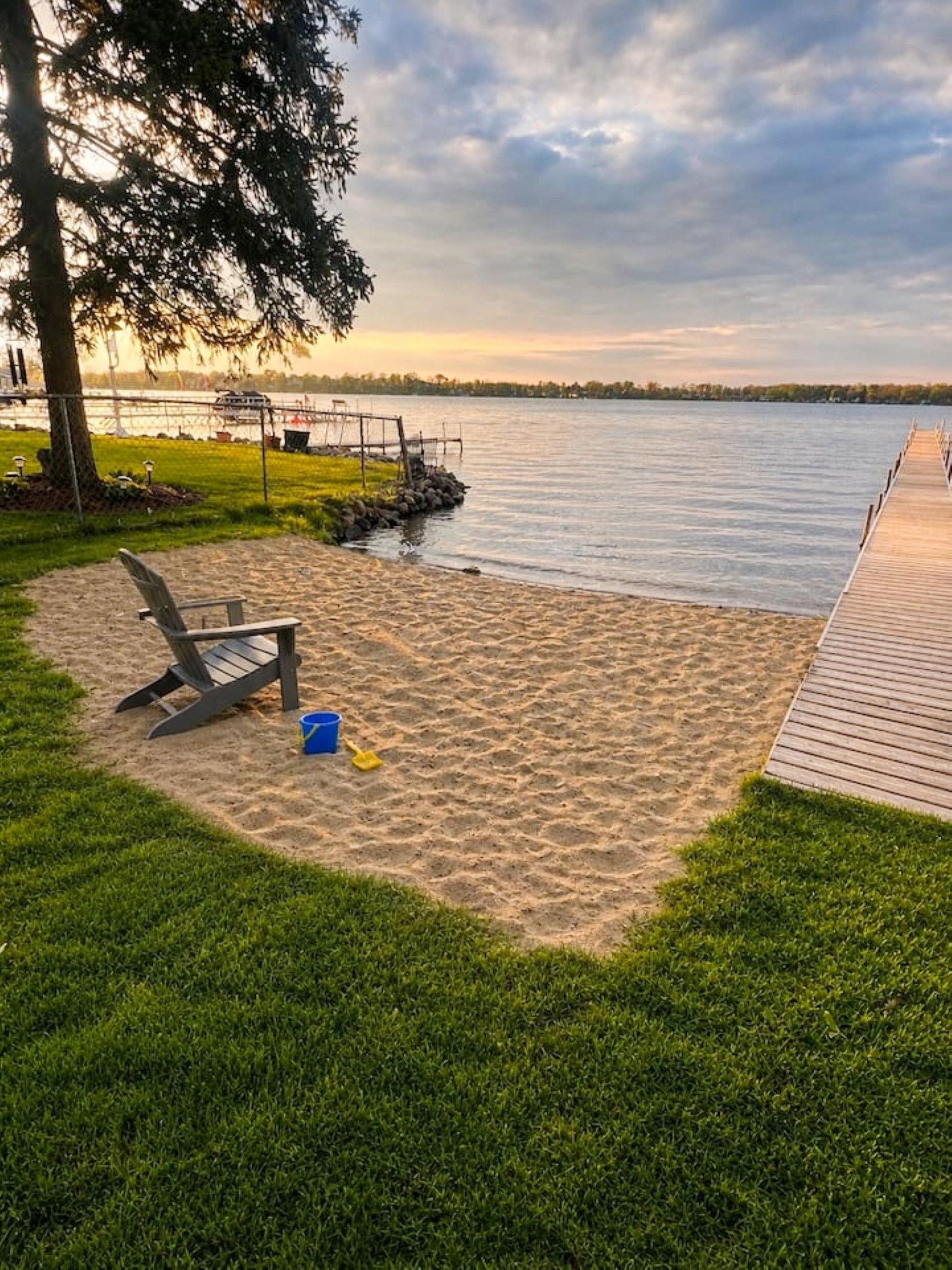 Beach area, boats will be on dock; This is a spring time photo. This area is shared with the few houses on the street. Dock is private and cannot be used. 