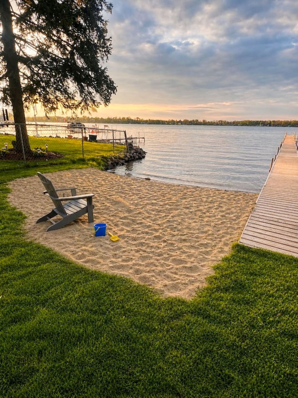 Beach area, boats will be on dock; This is a spring time photo. This area is shared with the few houses on the street. Dock is private and cannot be used. 