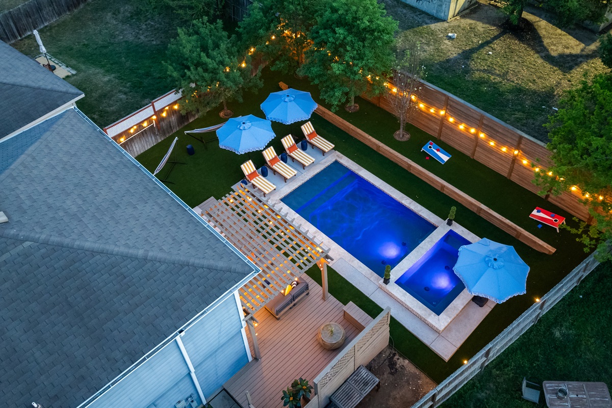 Dream backyard. Pool, spa, loungers, umbrellas, pergola, backyard games