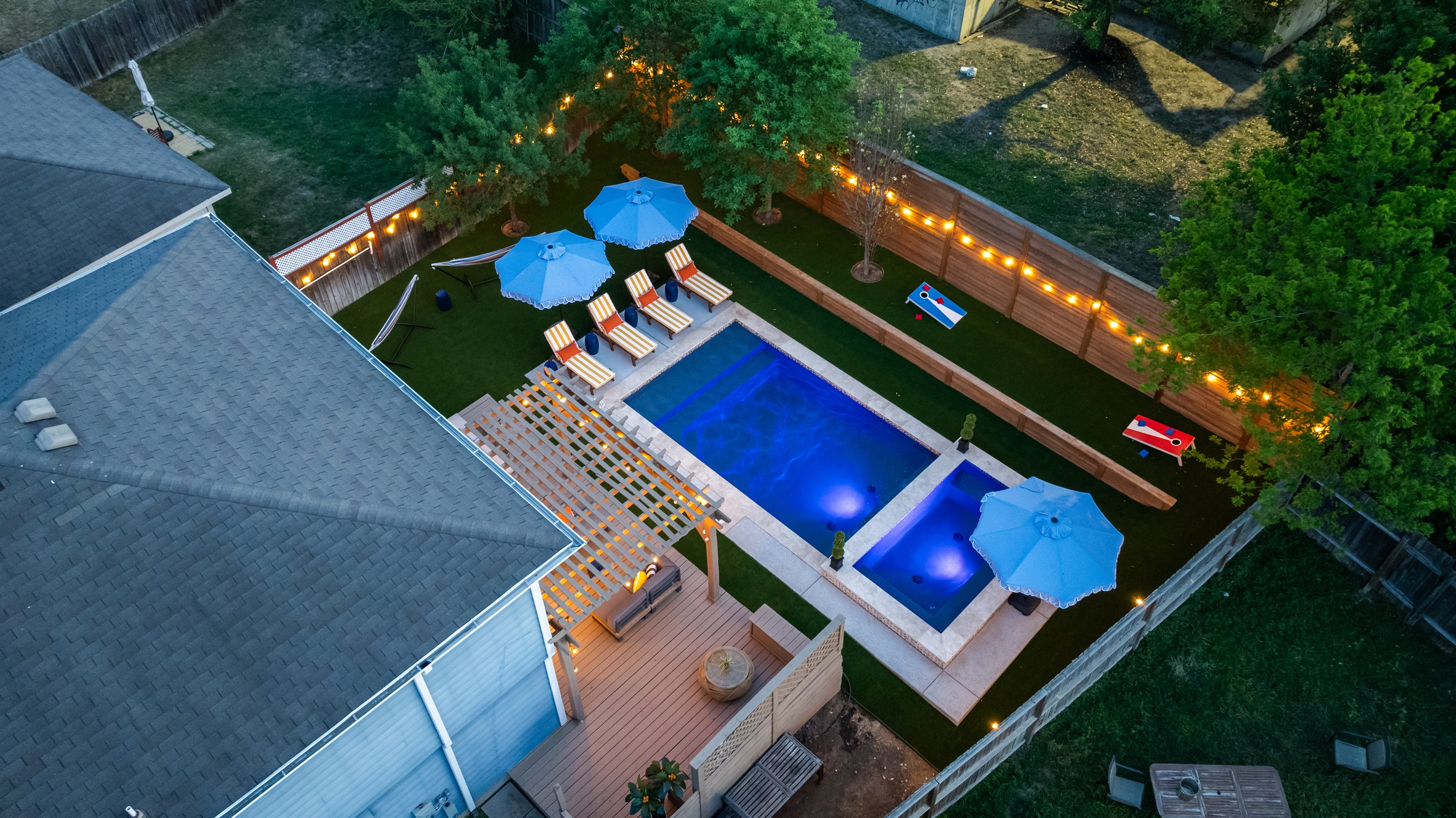 Dream backyard. Pool, spa, loungers, umbrellas, pergola, backyard games