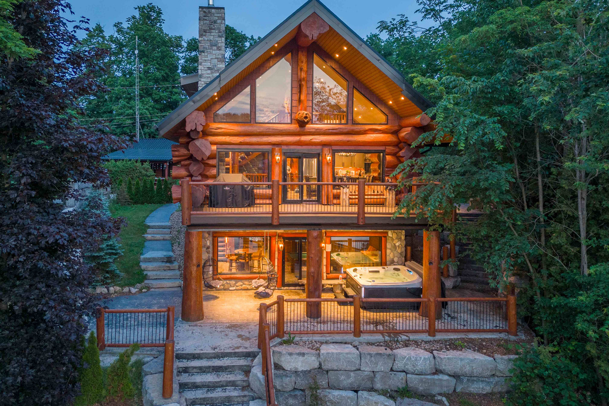 Bear Lodge glowing at dusk beneath the surrounding trees