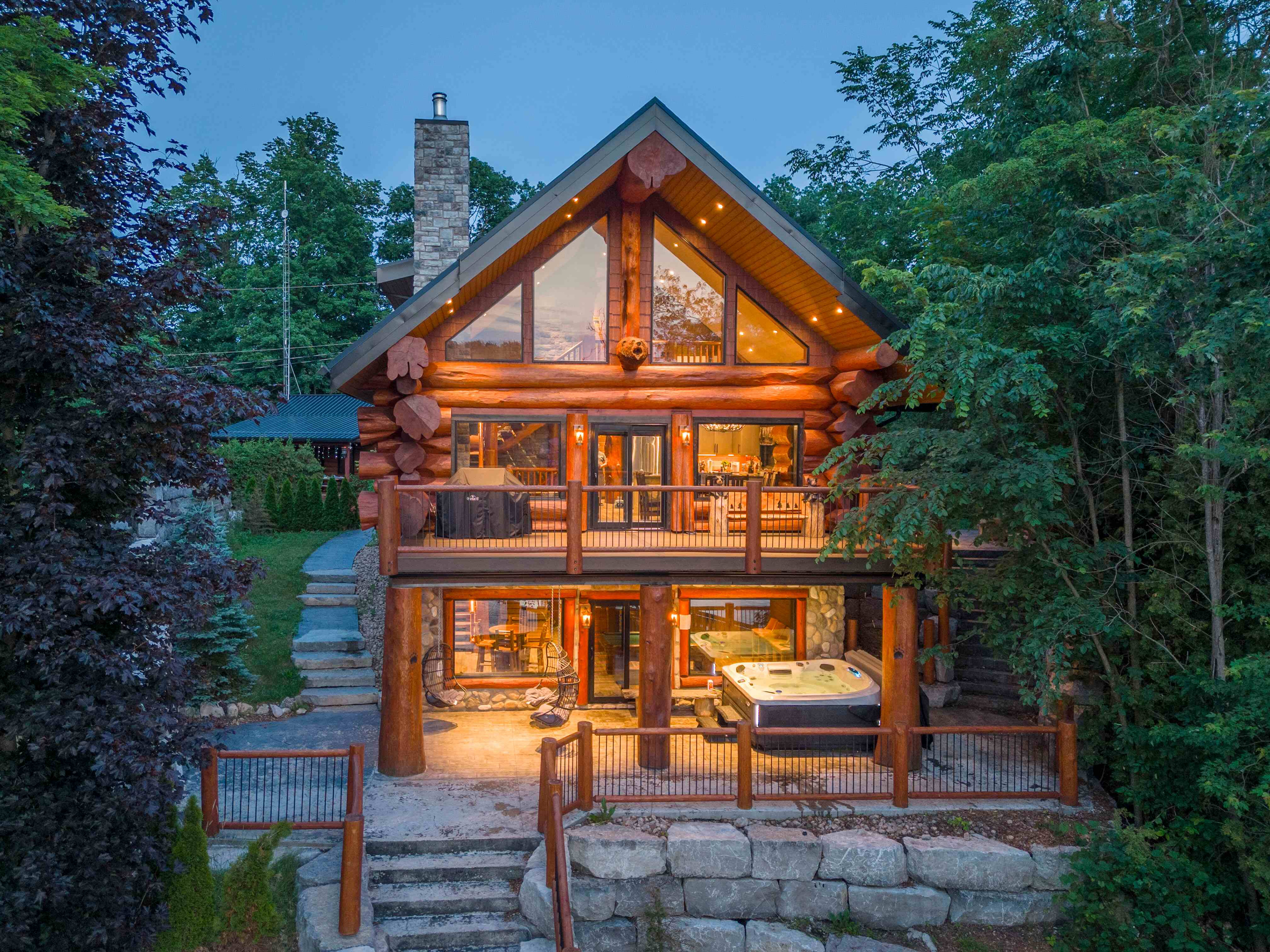 Bear Lodge glowing at dusk beneath the surrounding trees