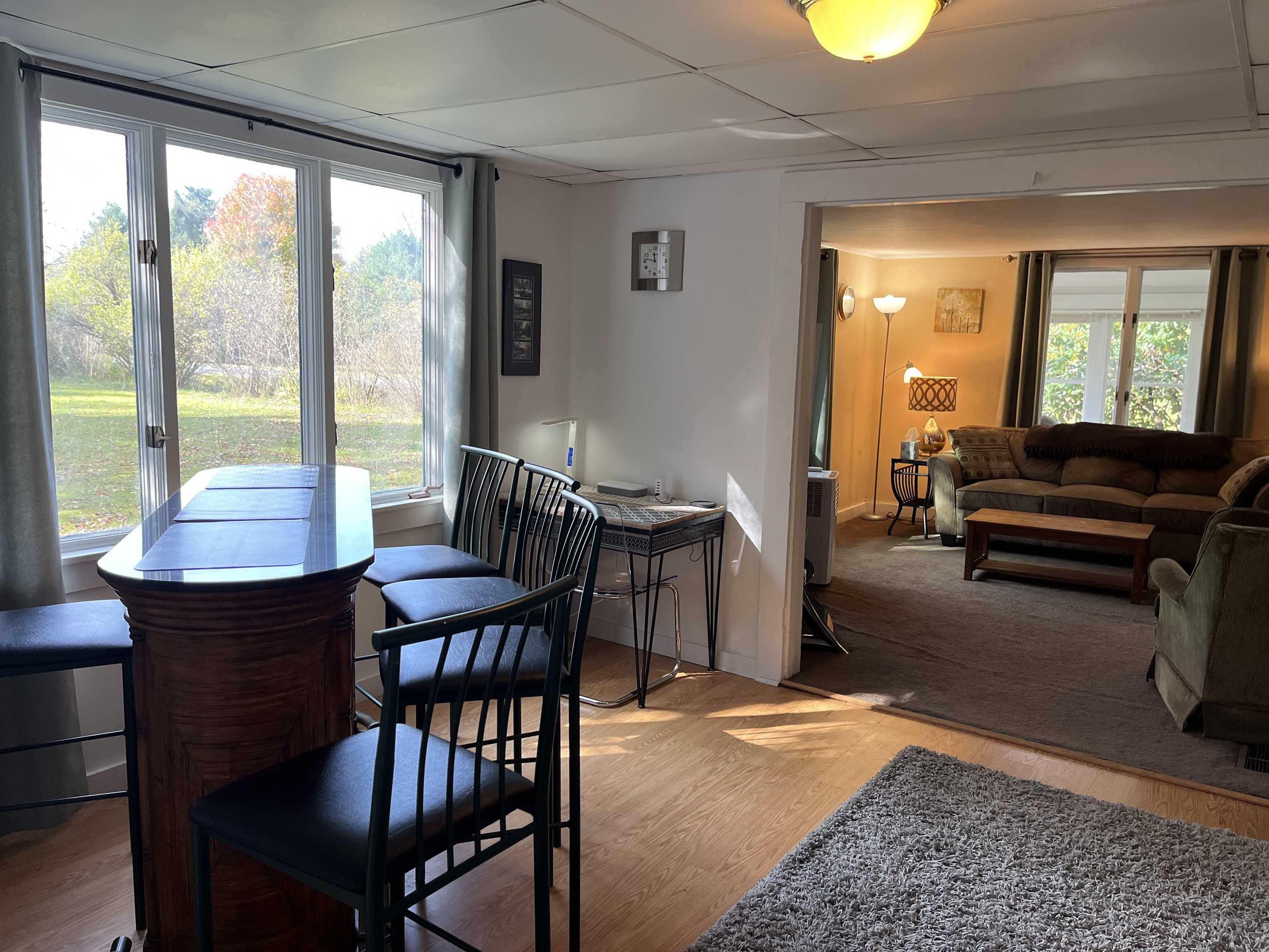 Bar and desk space with living room beyond