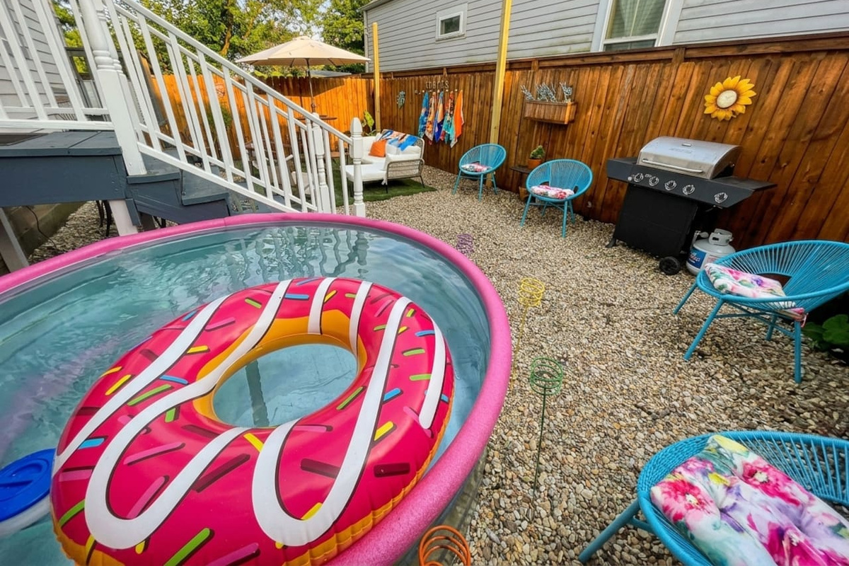 The backyard patio is perfect for enjoying a private hang with your group under the string lights!  Comfy outdoor sectional, high-top dining table, and stylish chairs.  Also feel free to use the propane BBQ grill.  Oh, and the Cowboy POOL!