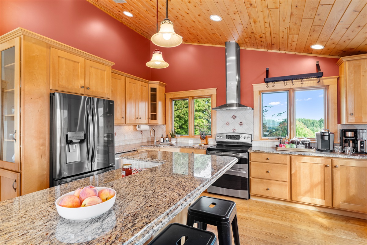 The heart of the home is ready for gathering. This fully stocked kitchen with island seating and beautiful views makes it easy to cook, connect, and enjoy every moment together.