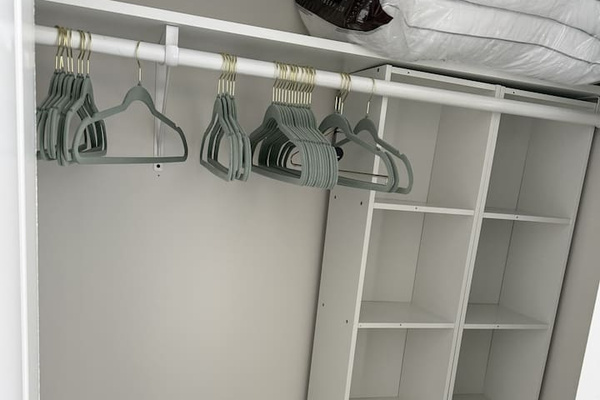 Full closet with storage space