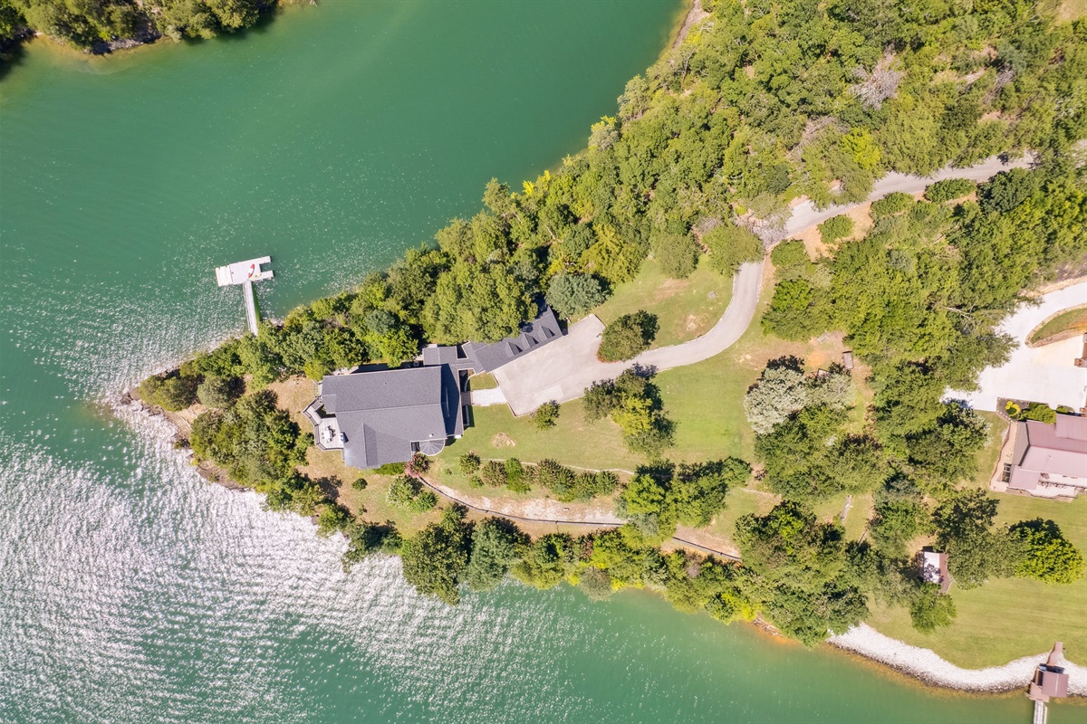 Home on a Peninsula with water on 3 sides; dock on back side in a private cove