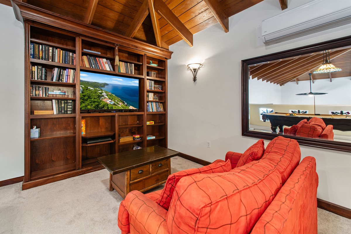 The big screen TV is perfect for watching games or a movie night.