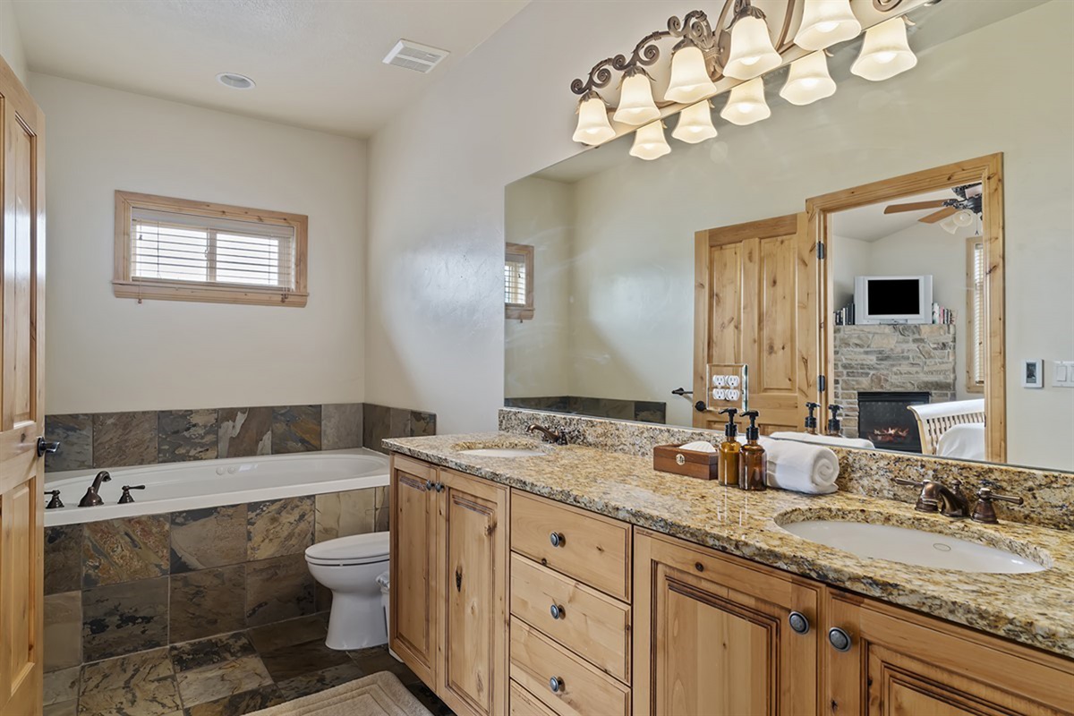 Luxurious primary bath with soaking tub and spacious layout—your private sanctuary to unwind and relax.