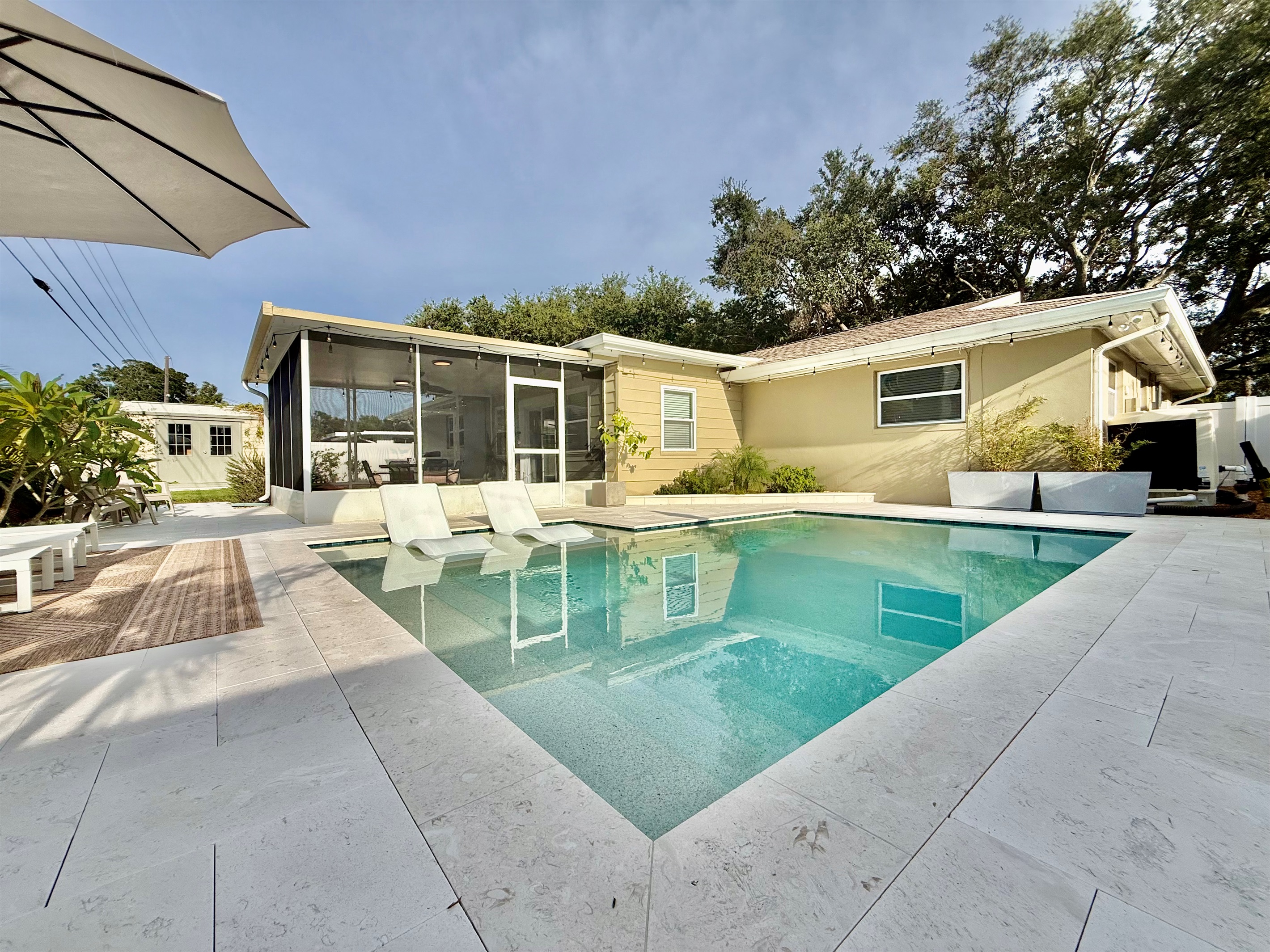 Whether you’re cooling off in the water or dining beneath the fan, this space is designed for maximum comfort.