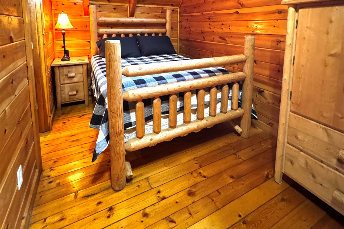 Upstairs queen bedroom with ensuite bathroom and fireplace
