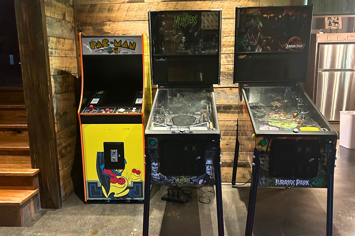 Arcade fun awaits with a classic Pac-Man machine and two themed pinball games.
