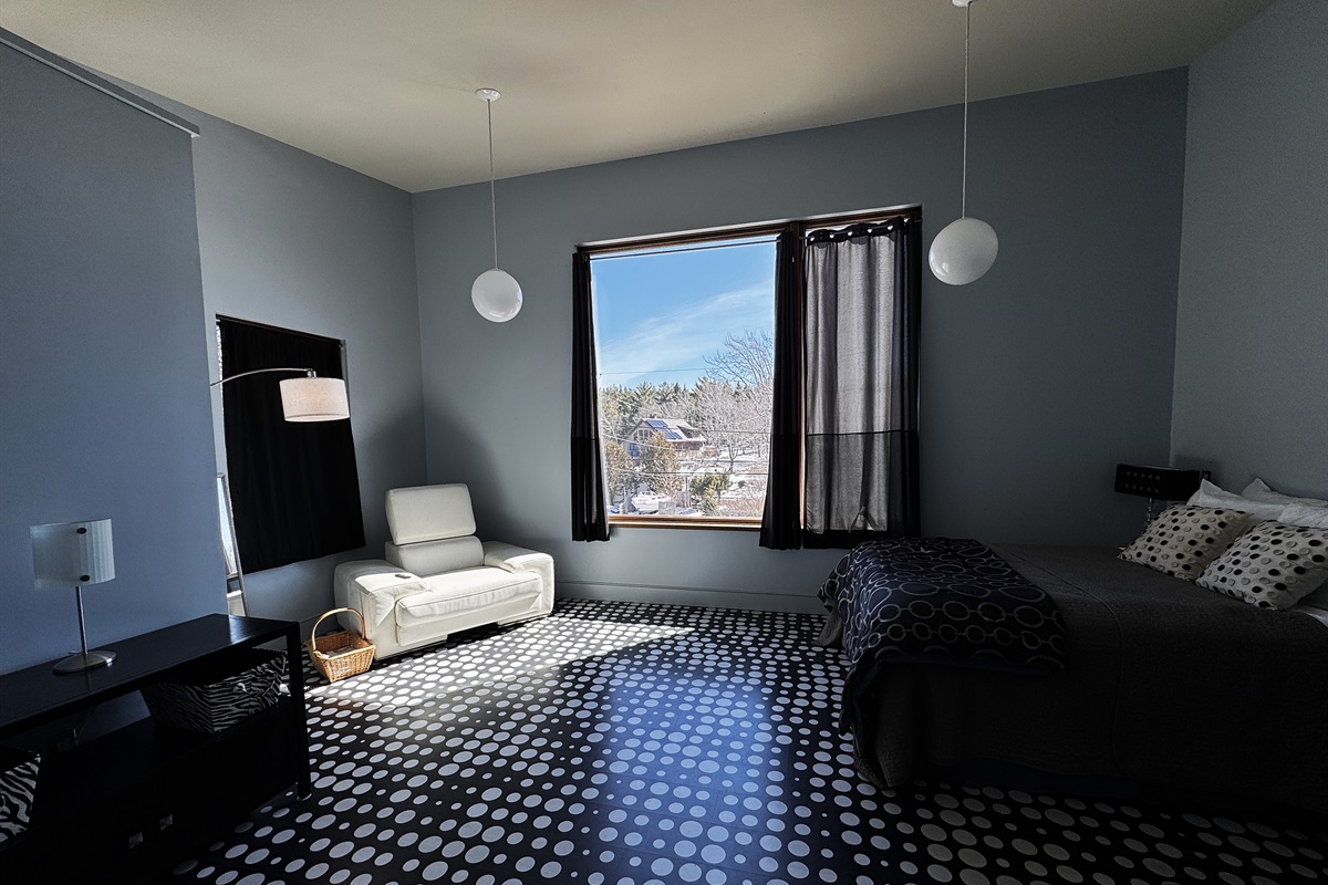 Reach the summit of "The Crag" in our iconic Sky Loft. Ascend the Sky Passage to this third-floor designer sanctuary, featuring a Queen bed, bold graphic laminate flooring, and bird’s-eye views of historic Otter Creek and the Acadia wilderness.