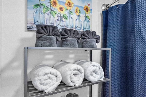 Fresh towels provided — bathroom stocked for a comfortable stay