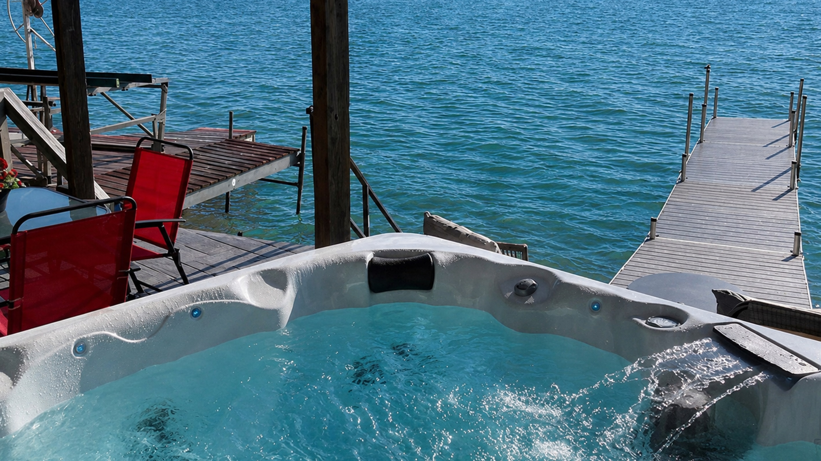 Immerse yourself in pure relaxation with our stunning lakefront hot tub. Nestled at the edge of the water, this outdoor haven offers sweeping views of the serene lake and surrounding nature.