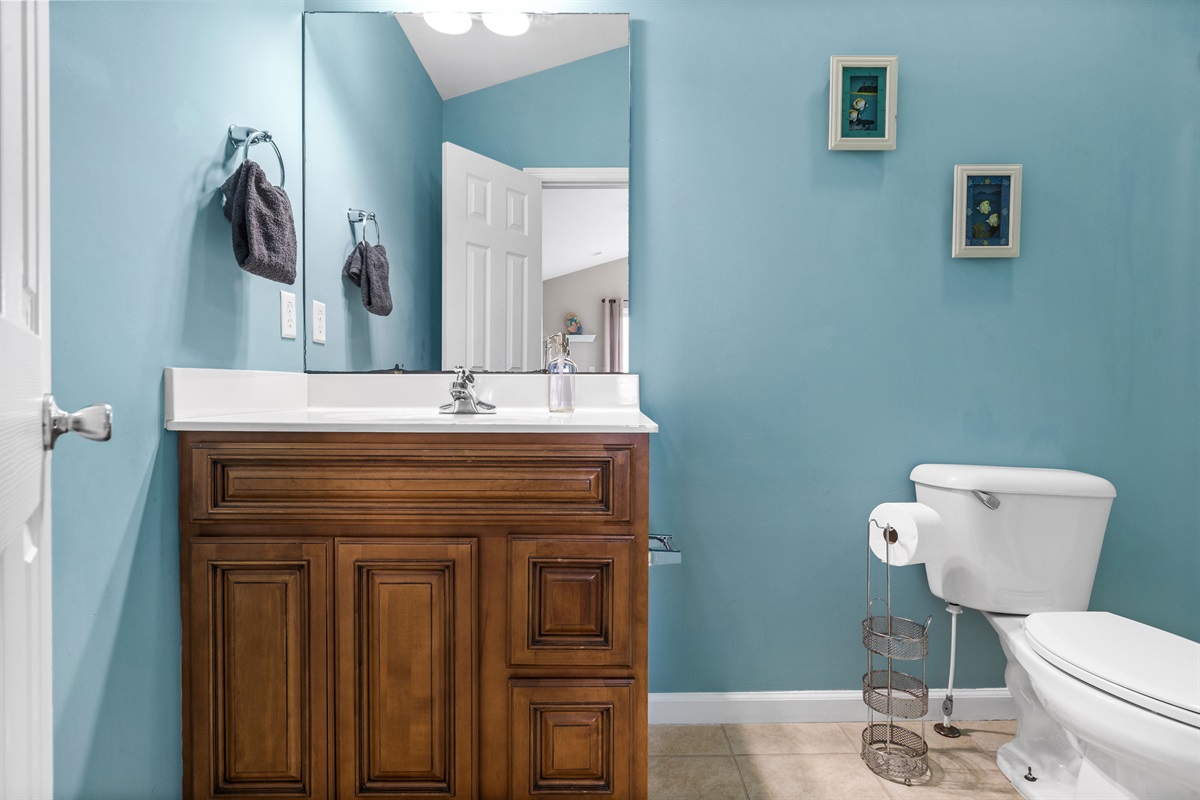 Bright master bathroom with coastal tones and spacious vanity