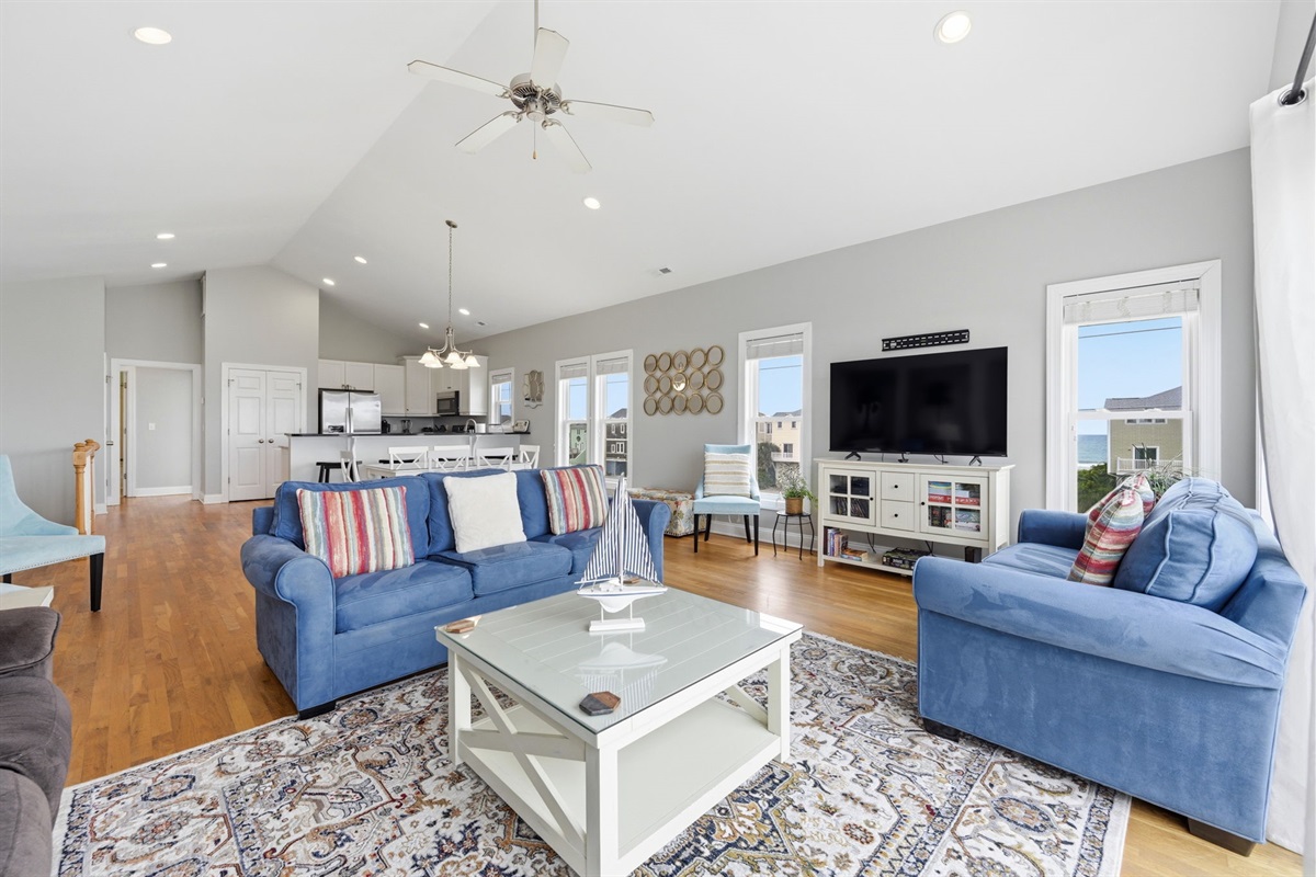 Bright coastal living room with easy access to the deck