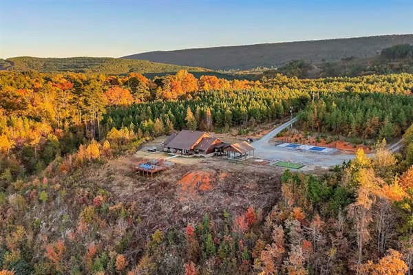 Fall aerial view highlighting the cabin’s privacy and stunning seasonal colors.