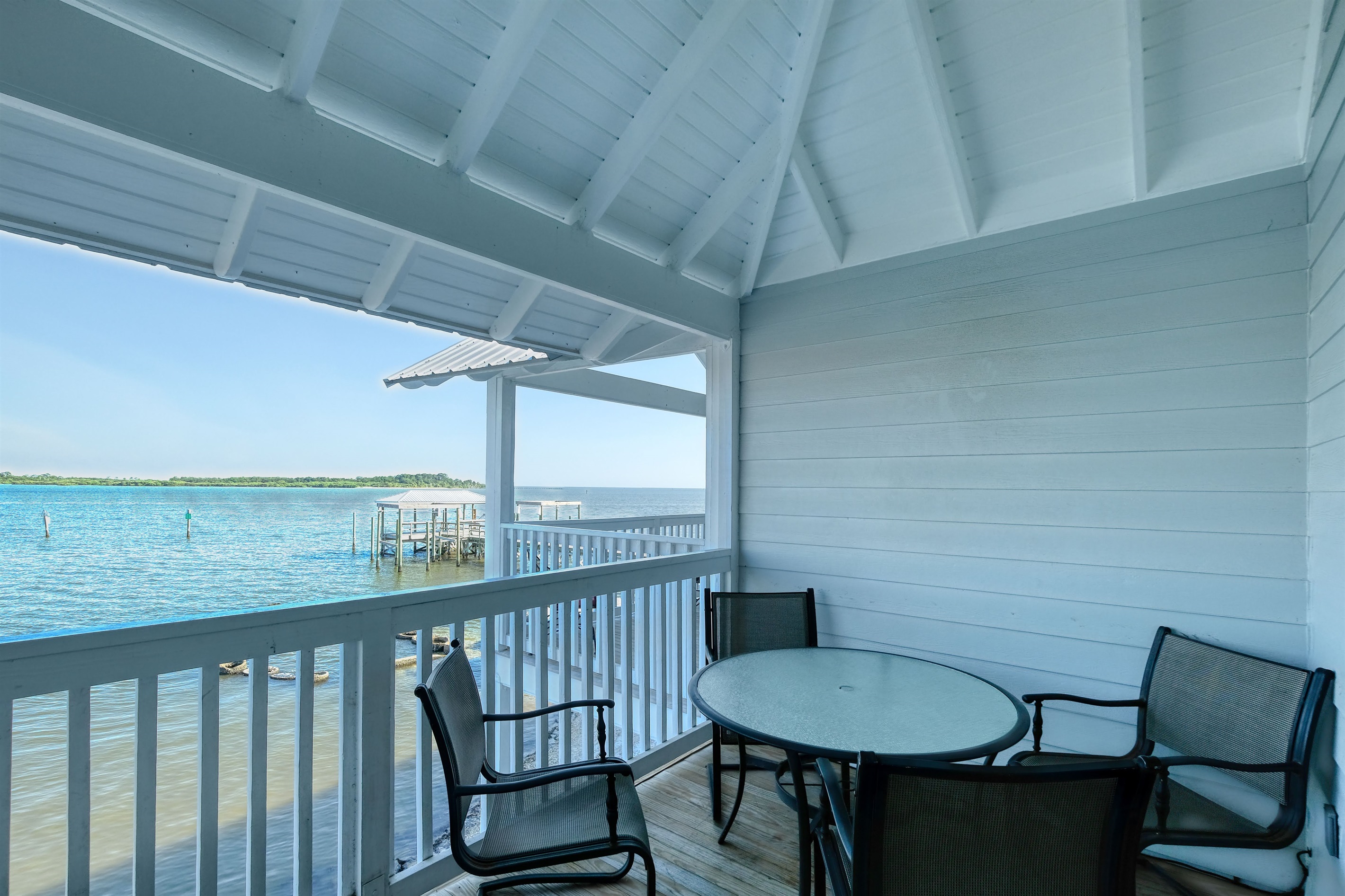 Table and chairs on porch for outdoor dining or morning coffee