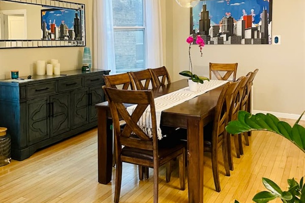 Dining room with warm lighting and plenty of space for group meals.