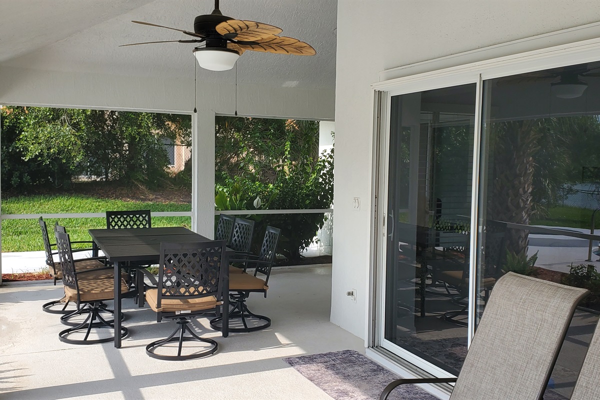 Oversized lanai with outdoor table and seating