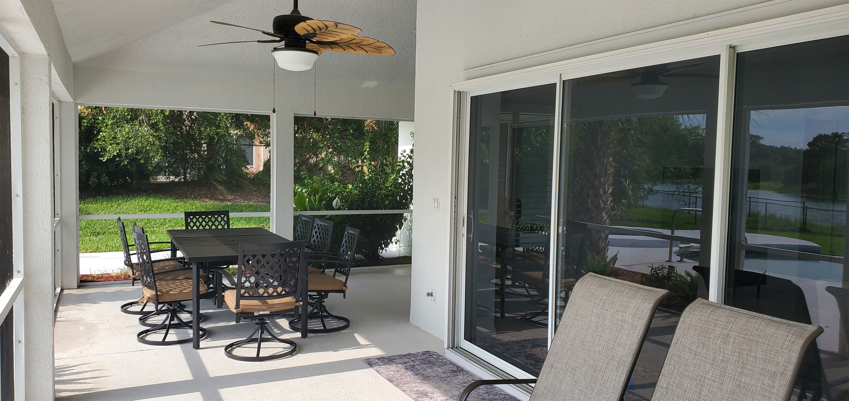 Oversized lanai with outdoor table and seating