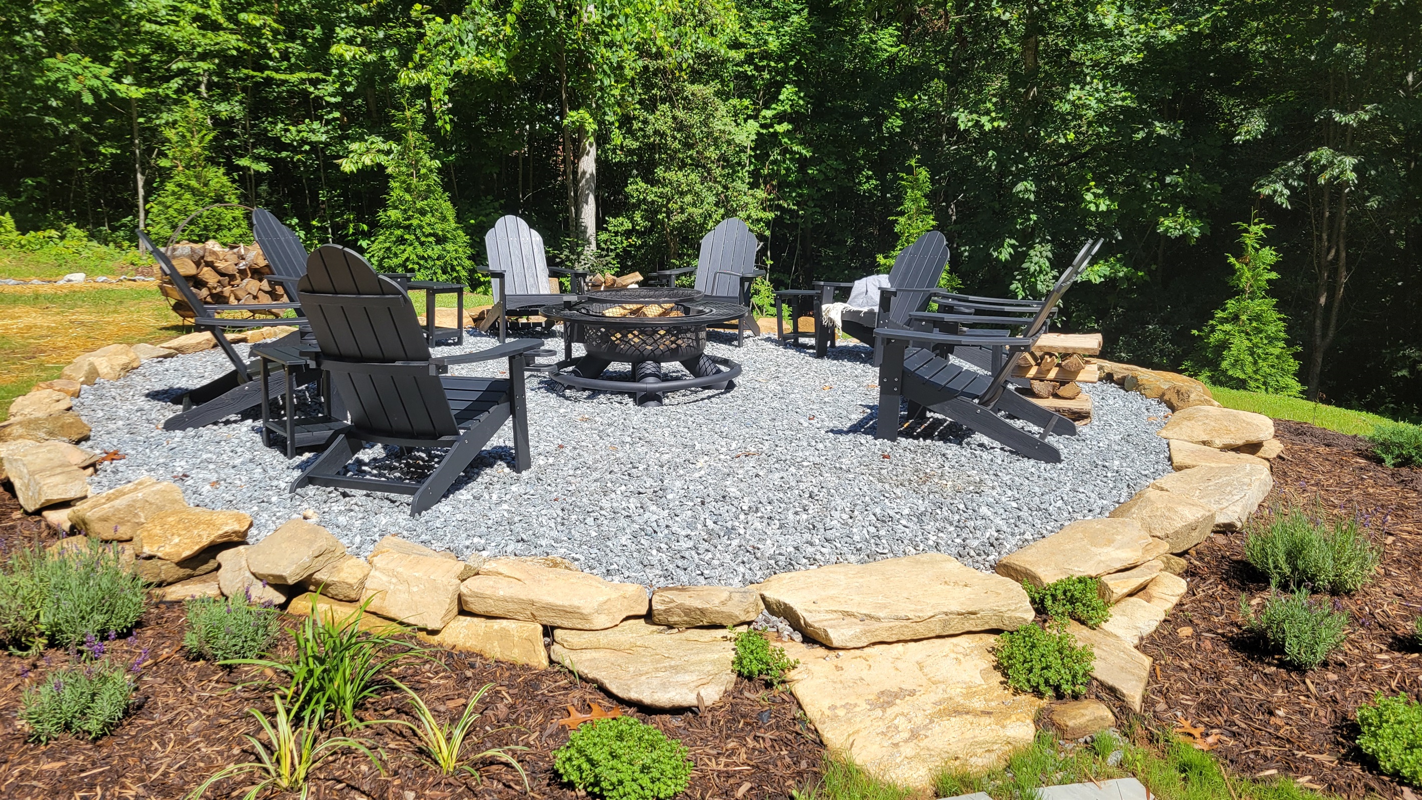 Gather with friends & family at the firepit, with 8 classic Adirondack chairs + side tables on a gravel pad and a boulder border. Whether you're roasting marshmallows, sharing stories, or stargazing, this cozy outdoor setup is made for unforgetable moments